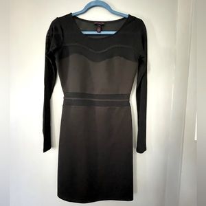 Black long sleeve dress with sheer accents.
